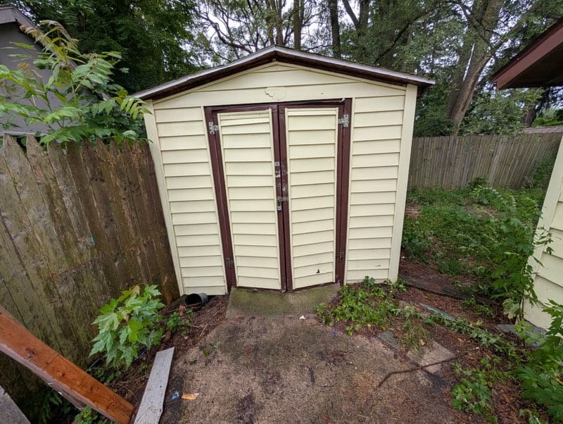 Outdoor shed after power washing by Carpet Rescue Pro.