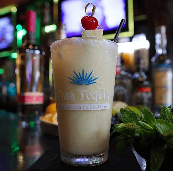Refreshing creamy cocktail with cherry garnish at Casa Tequila Mexican Grill & Cantina.