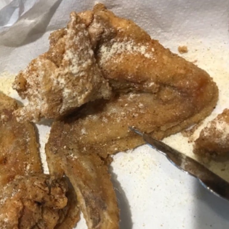 Delicious crispy fried chicken wings and drumsticks from Corine's Soul Food. Perfectly seasoned and cooked to golden perfection, ideal for comfort food lovers.