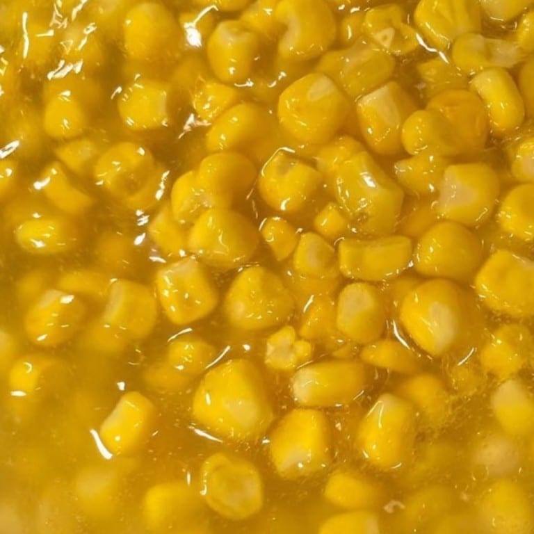 Delicious buttered corn kernels, freshly cooked and seasoned for a savory taste. Perfect for side dishes or snacks, showcasing Corine’s Soul Food's flavorful catering.