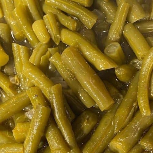 Fresh cooked green beans, seasoned and tender, served as a delicious side dish at Corine's Soul Food, Cakes & Catering.
