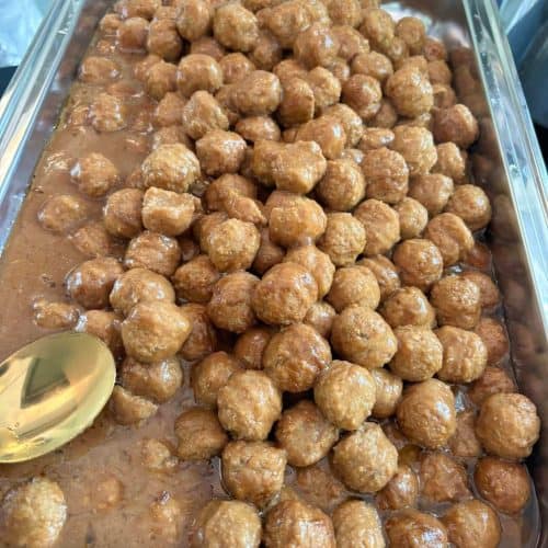 Delicious homemade meatballs served with flavorful gravy, perfect for catering or family gatherings. Freshly prepared with quality ingredients, showcasing Corine's Soul Food expertise.