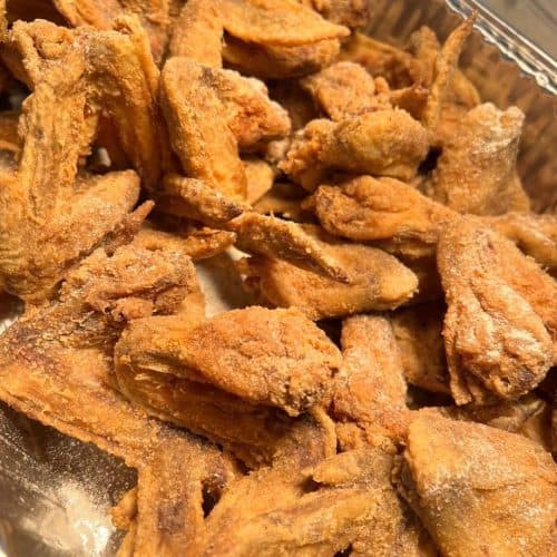 Delicious crispy fried chicken wings, perfect for catering or family meals, showcasing authentic soul food flavors.
