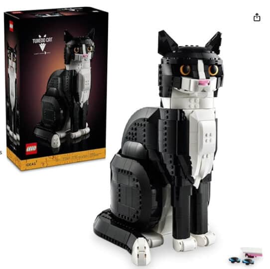 Model of a lego black and white cat and the box it comes in