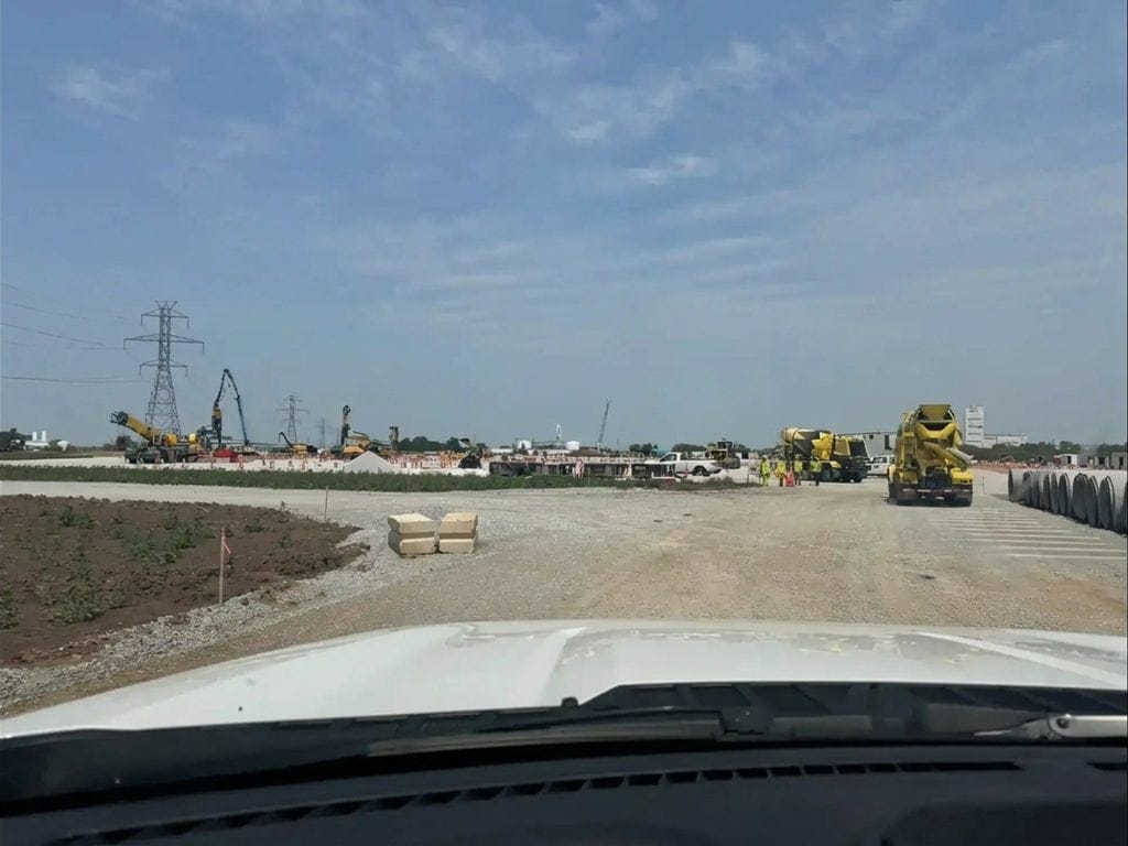 Substation construction in Northern Indiana with heavy machinery and power lines.