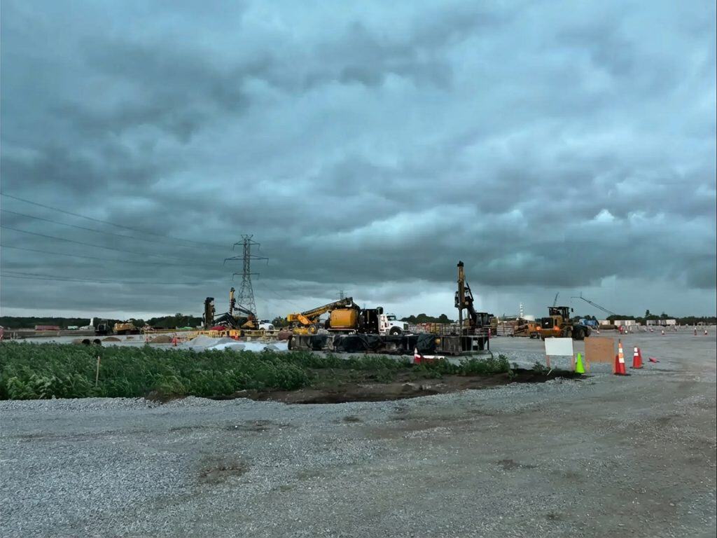 Construction site of a power substation in Northern Indiana under cloudy skies.