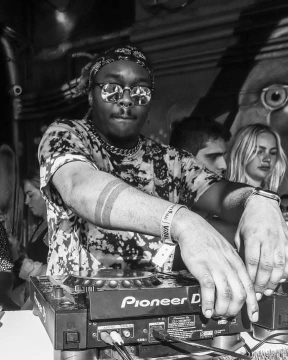 DJ at Dublin Square with sunglasses and patterned shirt in black and white.