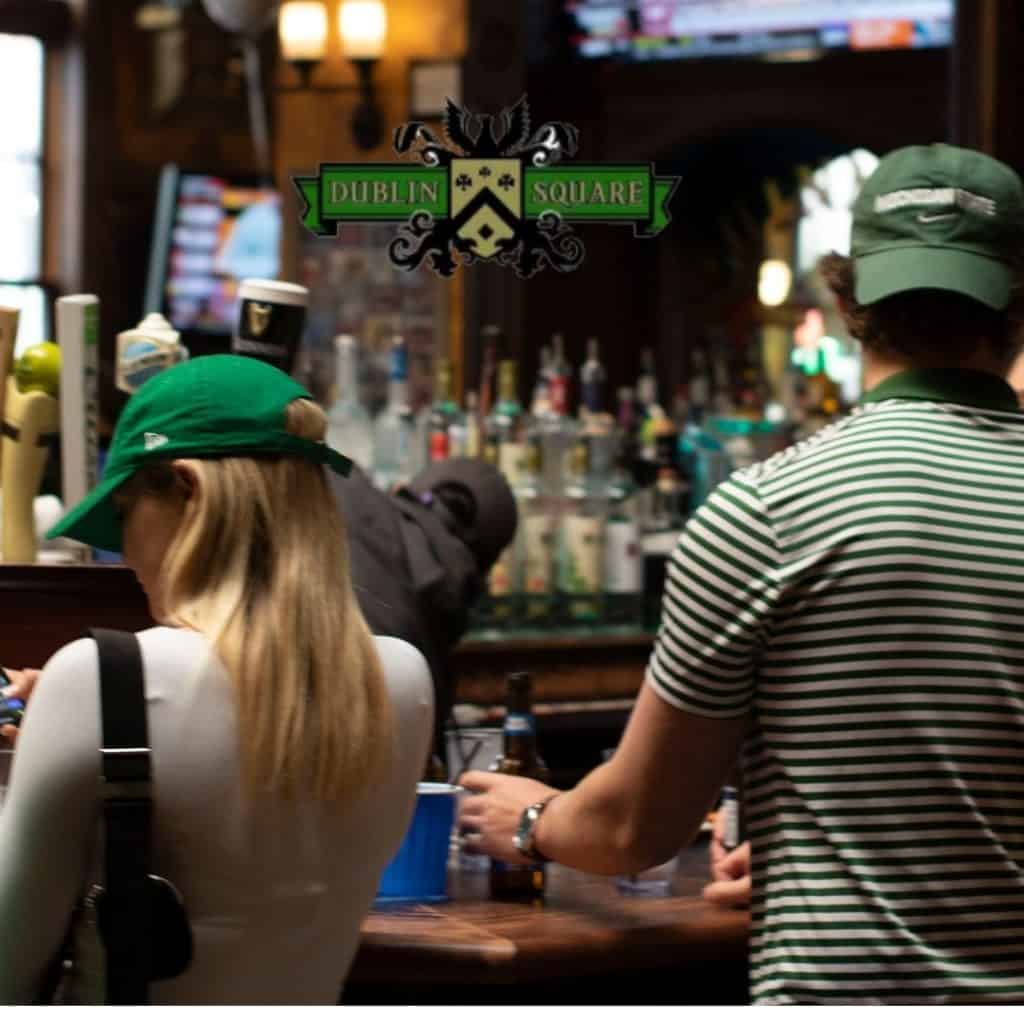 People enjoying drinks at Dublin Square bar in Lansing, Michigan.