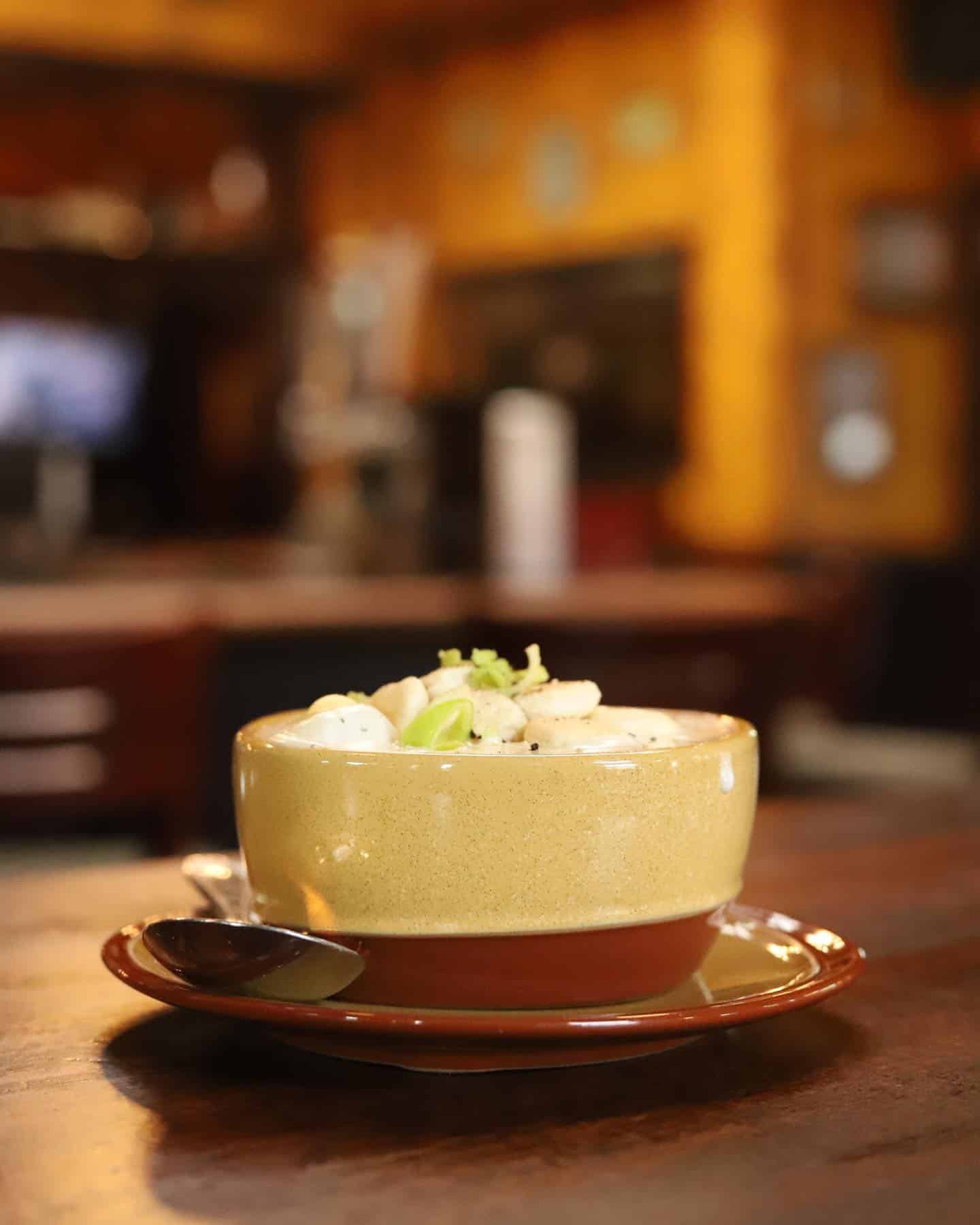 Close-up of a bowl of creamy soup at Dublin Square restaurant.