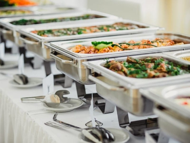 catering platters and tins filled with food