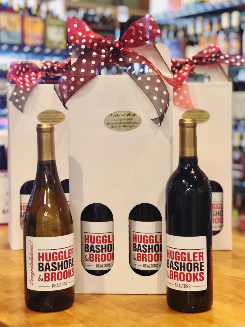 Hugger Bashore & Brooks wine bottles with branded labels and decorative ribbons.