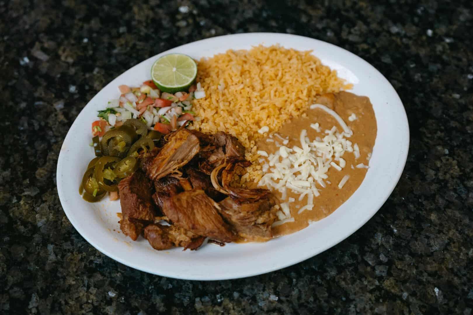 Mexican lunch plate with rice, shredded beef, beans, and salad at El Burrito Loco.