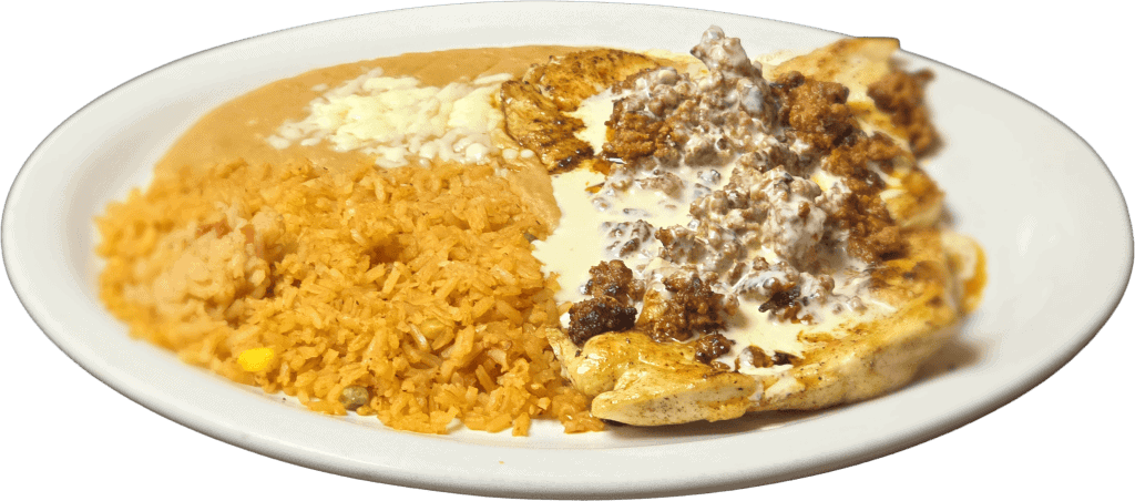 Traditional Mexican plate with rice, beans, and beef fajitas at El Mesquite.