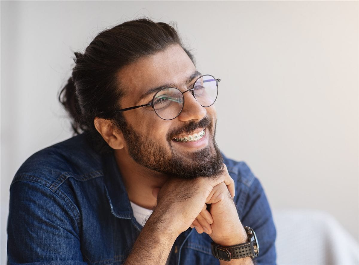 Adult smiling with braces