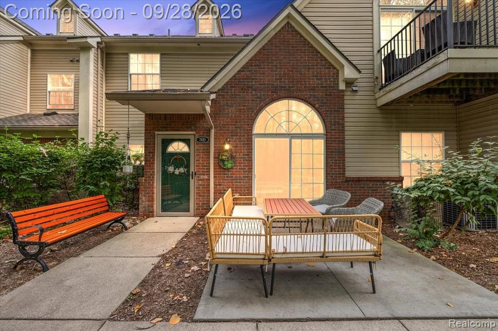 Brick and siding exterior with a covered entry
