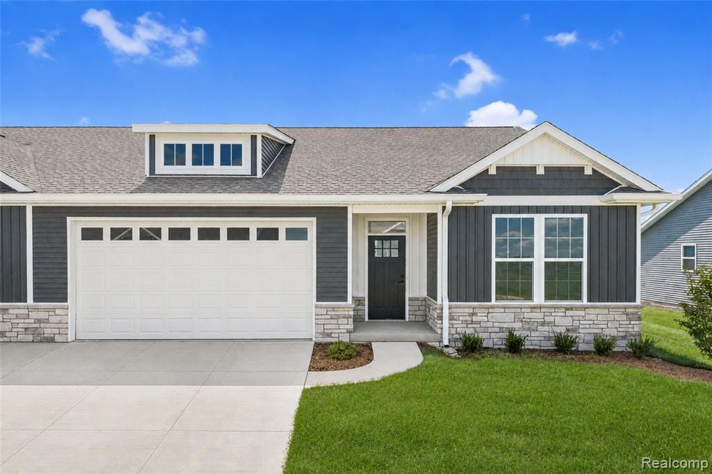 Craftsman-style exterior with dark siding and stone accents