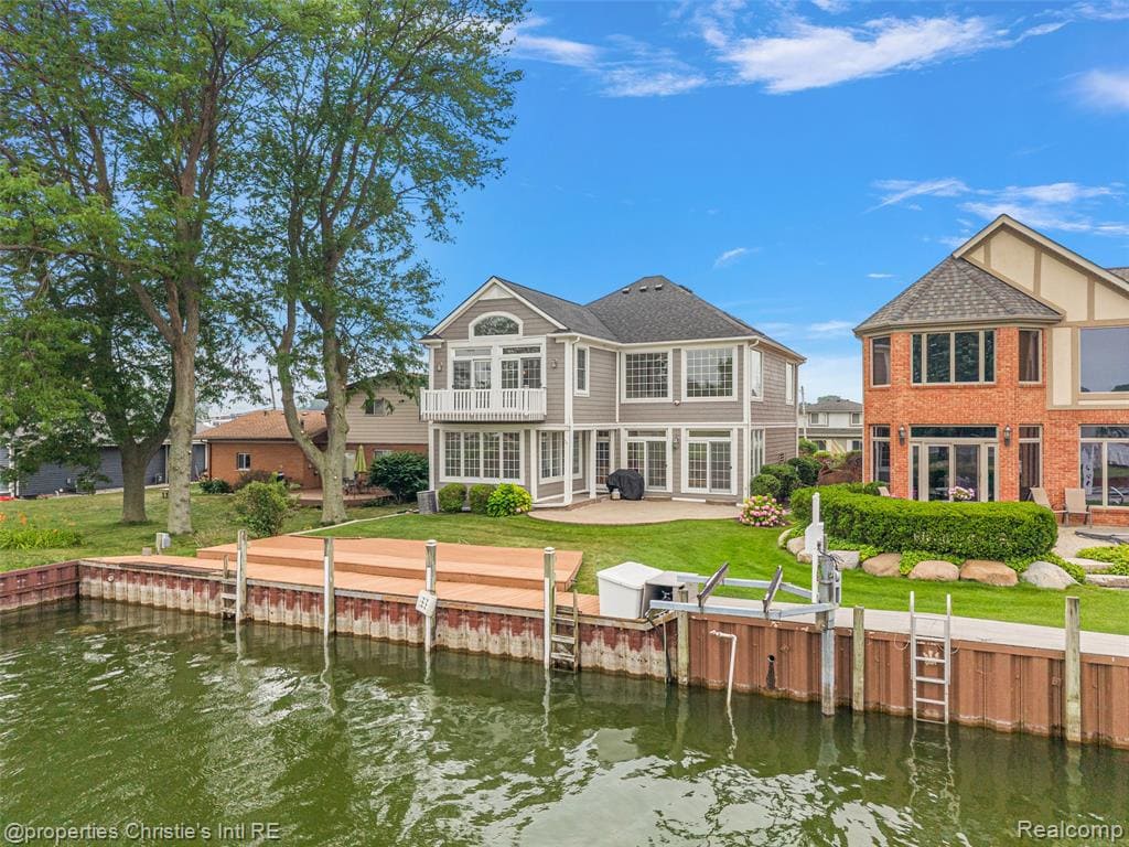 Welcome to 31975 Riverdale Street, a Huron Pointe waterfront home in Harrison Township offering 50 feet of canal frontage, a private boat dock, and quick boating access to Lake St. Clair.Enjoy spectacular sunset views, peaceful waterfront surroundings, and the boating lifestyle that makes Huron Pointe one of the area's most desirable communities.Inside, you'll find an inviting floor plan designed for everyday living and entertaining. The spacious kitchen features Lafata cabinetry, granite countertops, and abundant workspace, opening seamlessly into an impressive two-story great room with soaring ceilings, three skylights, and a cozy gas fireplace. A bright sunroom overlooks the canal, creating the perfect place to relax and enjoy the view.Step outside to your expansive Trex deck overlooking the water—ideal for morning coffee, waterfront dining, or unwinding after a day on the lake. A circular brick paver patio offers additional outdoor living space, while the private boat dock and steel seawall make boating effortless.Upstairs, the spacious primary suite features a private Trex balcony overlooking the canal, a relaxing hot tub, and a generous walk-in closet.Additional features include: New Seawall 2004, New roof 2019, New siding & gutters 2018, Exterior paint 2018 (20 yr. paint), New carpet & interior paint this year, central Vacuum and Sprinkler system.If you've been dreaming of living the Michigan lake life, this exceptional Huron Pointe waterfront home is ready to welcome you home.