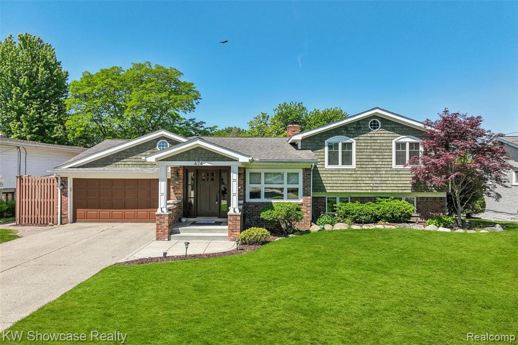 Fantastic contemporary quad home on a cul-de-sac street with canal frontage.  There is a boat slip and access to both Otter and Sylvan lakes.  Imagine feeling like you're on vacation all year long!  The views of the canal and surrounding homes on both sides of the wide canal are beautiful.  Gorgeous hardwood flooring in the dining area, living room, kitchen and library/office.  Open floor plan in the dining room/living room with a doorwall out to the picturesque backyard.  Gorgeous updated kitchen has a six burner gas cooktop,  stainless steel appliances, granite countertops and large pantry. The lower level family room has a gas fireplace, built-in bookshelves and a doorwall out to the patio.  The office/library has a built-in desk and bookshelves, and is the perfect setting for one who works remotely. There is an updated full bath with a whirlpool tub and wood vanity adjacent to the office/library.  The laundry room is equipped with many cabinets for storage. The three bedrooms upstairs have ample closet space and carpeting.  Two of the bedrooms have chair railings and all bedrooms have simple crown molding.  The upper level updated full bath has a large glass door shower and bench.  The vanity has a granite counter. The basement is finished and has the fourth bedroom with daylight windows.  The third full bathroom has a stall shower and ceramic flooring The bathroom is located across the hall from the bedroom.  The game room/recreation room is perfect for exercising.  A doorwall to the patio takes you to the beautiful and well landscaped yard.  There is a covered storage area for boat equipment or other items.  Two car attached garage with an addition for more storage space. Some photos have been virtually staged to remove furniture.  No virtual tours per the Seller.  A licensed agent must accompany all Buyers and be present for all showings.   This house is special!