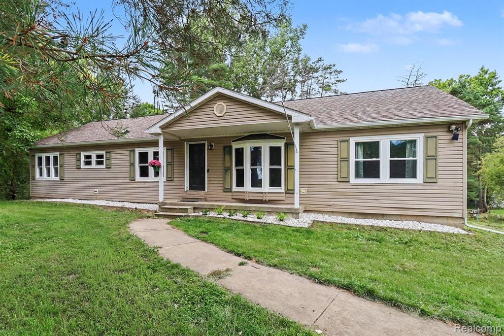 Siding exterior with a covered porch entry