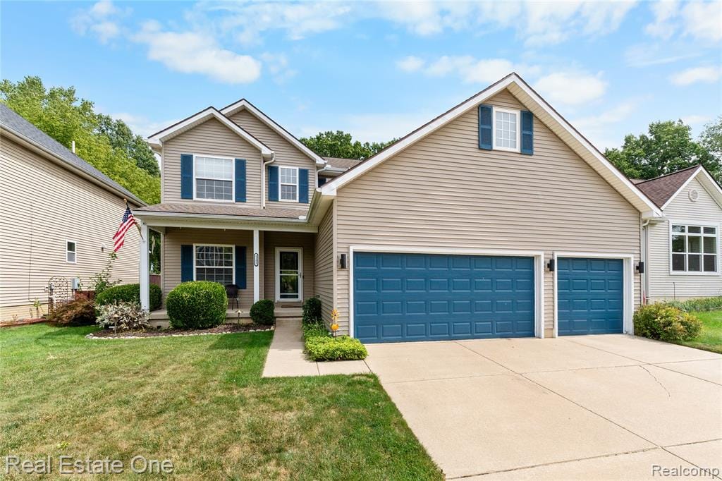 Two-story exterior with neutral siding, a covered front porch, and a concrete driveway