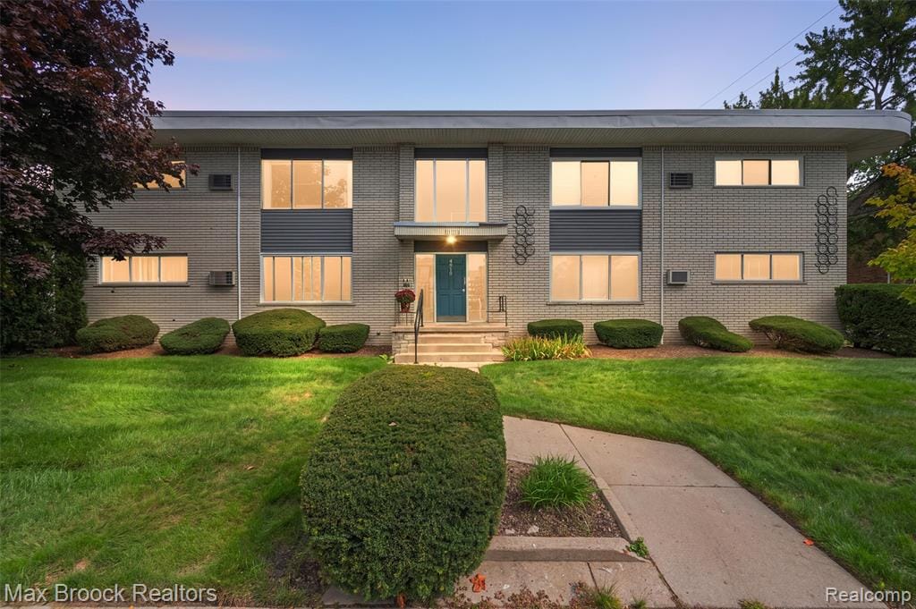 Classic brick exterior of condominium building in well-established setting