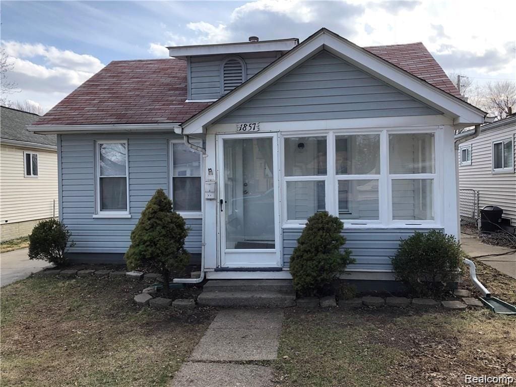 Light blue horizontal siding exterior with white trim