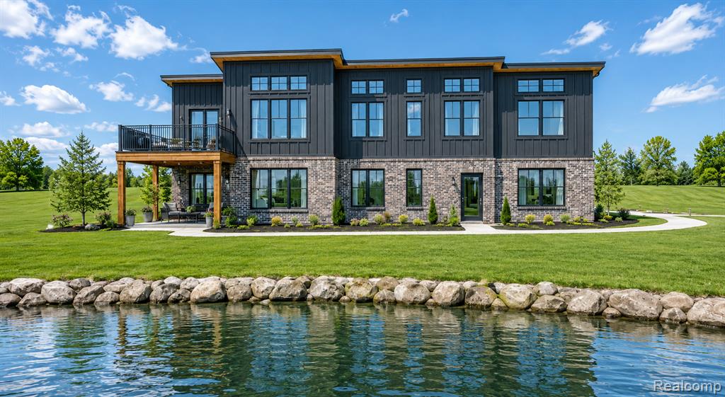 Stunning New Construction Waterfront Home in White Lake (To Be Built)Experience lake living in this brand-new modern 4-bedroom, 3-bath home, perfectly situated on a beautiful waterfront lot in White Lake, Oakland County. With over 150 feet of shoreline, the property offers scenic views of a nearby island and a site line down a canal that connects directly to all-sports Round Lake ideal for boating, paddle boarding, and year-round enjoyment.Inside, the open and functional layout is filled with natural light, with large windows framing water views from all four bedrooms, great rooms, and back deck. The main living area blends comfort and style, creating an easy space for both everyday living and entertaining, with ceiling soaring up to 13 high. Practical features include a spacious pantry, a mudroom with built-ins off the attached garage, and convenient main-floor laundry.Step outside onto your large back deck, where you can relax, entertain, and soak in the peaceful waterfront setting in any season.This is a rare opportunity to own a brand-new modern waterfront home with unbeatable value in an Oakland County location. Don't miss your chance to enjoy the perfect blend of modern living and natural beauty.