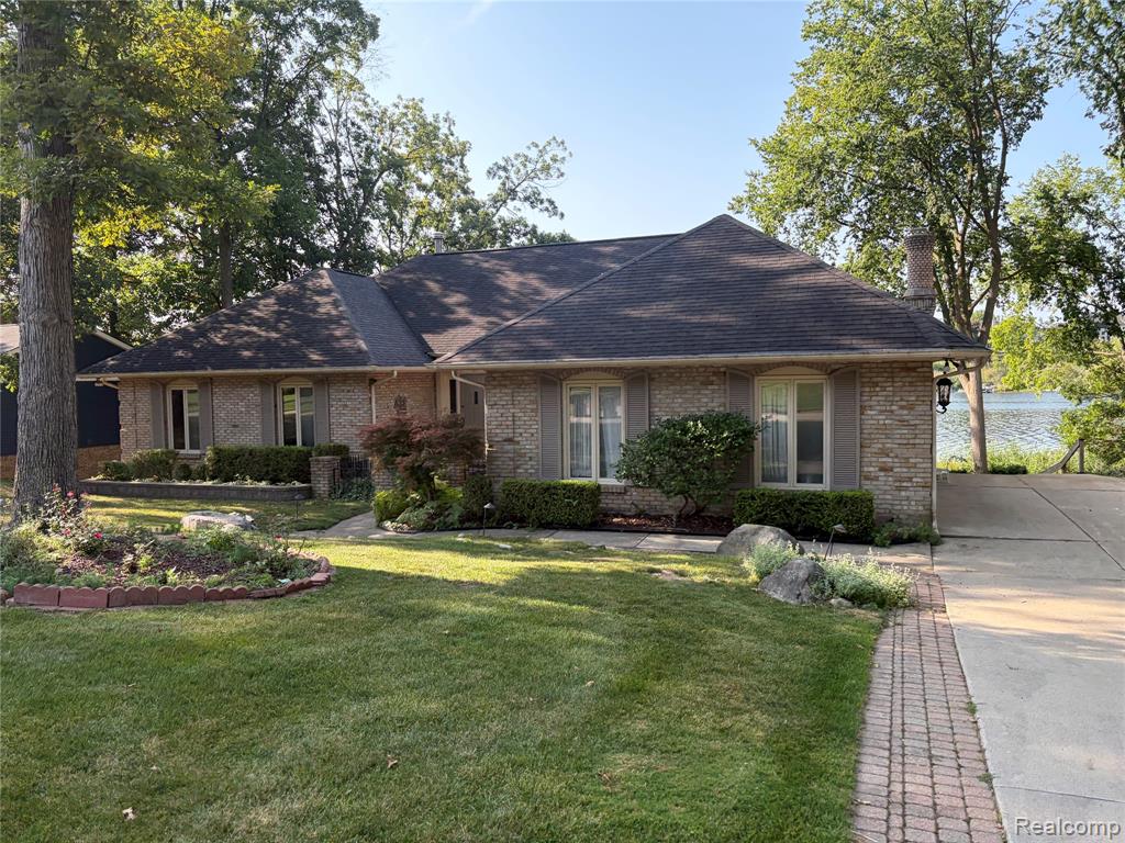 RARE FIND! LAKEFRONT LIVING ON ALL-SPORTS LONG LAKE WITH IMMEDIATE OCCUPANCY!Bring your decorating ideas to this sprawling 3-bedroom, 3.1-bath brick ranch featuring a finished walkout lower level and beautiful lakefront views. The inviting family room offers a cozy natural wood-burning fireplace, perfect for relaxing on cool fall and winter evenings.The kitchen features granite countertops and a breakfast nook overlooking the lake, with an adjacent formal dining room—ideal for everyday meals or entertaining guests. A convenient first-floor laundry provides the option for comfortable main-level living.The finished walkout lower level boasts panoramic lake views, new LVT flooring, and a second kitchen, creating an excellent space for entertaining, guests, or extended living. An additional lower-level room offers the flexibility to serve as a potential fourth bedroom, home office, or hobby room.Enjoy the outdoors from two balconies, one off the family room and another off the primary bedroom. The lower-level walkout opens to a generously sized concrete patio, perfect for outdoor entertaining and enjoying the peaceful lakefront setting.Home has had a private appraisal in the last 30 days and appraised at $815,000.00, this is priced to sell!There has been a neighborhood HOA of $125 that is currently not being collected.  Please contact HOA for more details.  There are covenant documents, but no by-laws.  There is an annual lake assessment of $132.82 that is collected directly by the township and an annual  drain assessment of .40 centsDock included with the sale! Conveniently located near shopping, dining, and Downtown Lake Orion, this is a fantastic opportunity to enjoy all that lakefront living on Long Lake has to offer.  This home has had a recent private appraisal appraising at $815,000.00 and this is priced to sell!