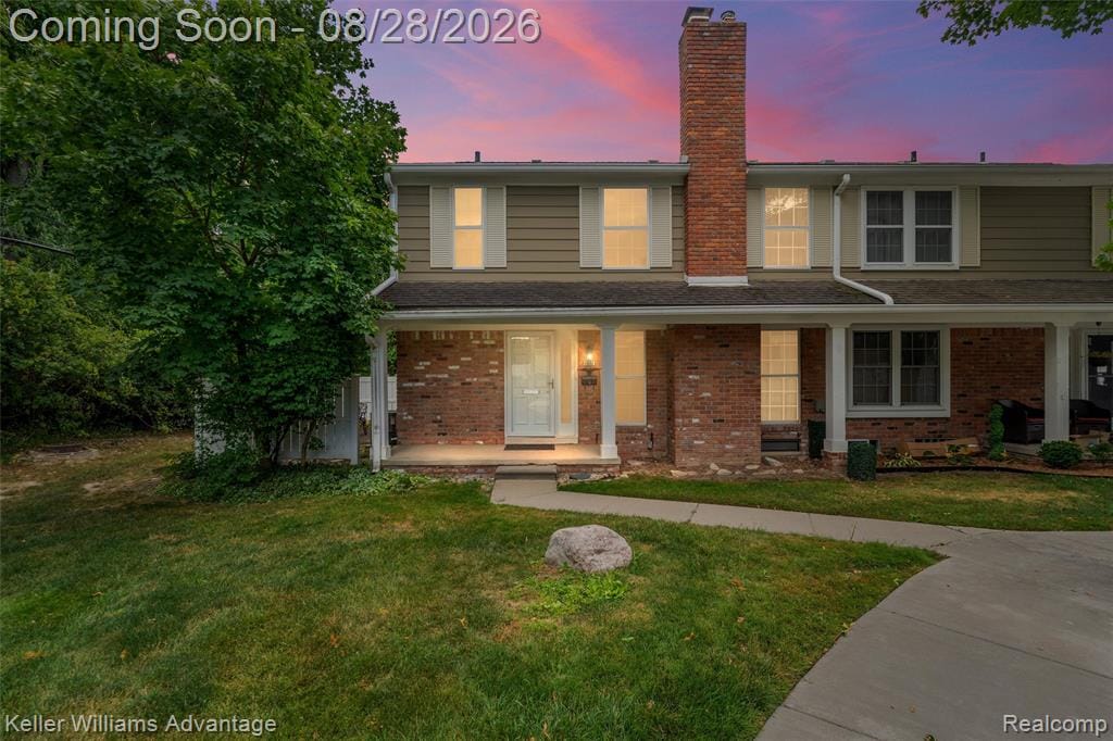 Two-story exterior with brick and covered front entry