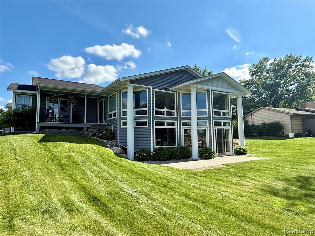 Experience lakefront living at its finest on beautiful all-sports Lake Lapeer! This move-in ready ranch offers breathtaking panoramic water views the moment you step through the front door. The entire back of the home is lined with windows, filling the living spaces with natural light and showcasing spectacular lake views from the kitchen, dining room, and main living areas. Designed with an open, loft-inspired layout, the kitchen and dining area overlook the spacious lower-level family room, creating the perfect flow for everyday living and entertaining. With 4 bedrooms and 4 full bathrooms, 2 Bedrooms have attached bathrooms, there's plenty of room for family and guests. The finished lower level features a second kitchen, making it ideal for hosting gatherings, or weekend visitors. Step outside and enjoy everything lake life has to offer with your private dock, boat hoist, and raft already in place. Whether you're boating, swimming, fishing, or simply relaxing by the water, this exceptional property is ready for you to enjoy from day one. Don't miss this rare opportunity to own a stunning waterfront home on sought-after Lake Lapeer—where every day feels like a vacation.