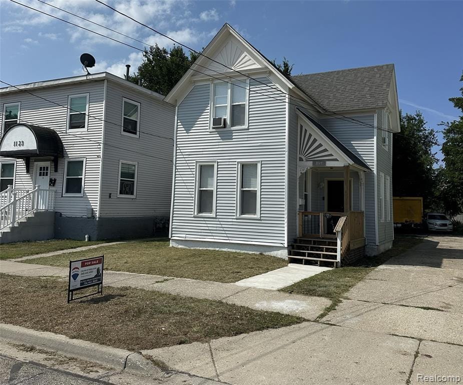 Light blue siding exterior with a pitched roof