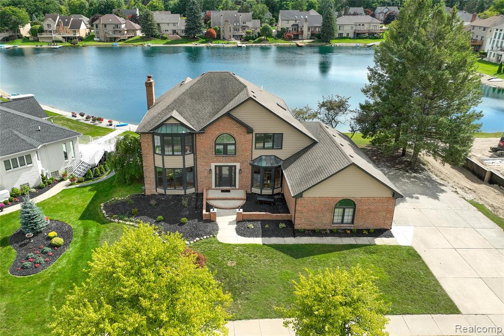 Welcome to this beautifully renovated waterfront colonial on private Forest Lake, offering over 4,600 square feet of exceptional living space, 4 spacious bedrooms, 3.5 beautifully updated bathrooms, and some of the most breathtaking water views you can imagine. Thoughtfully renovated this impressive home blends luxury, functionality, and modern style throughout. From the moment you step inside, you'll appreciate the attention to detail, abundant natural light, luxury finishes, and stunning views from multiple living spaces. The open-concept design creates an inviting atmosphere with plenty of room for everyday living and entertaining. The completely redesigned gourmet kitchen features beautiful countertops, a large center island, and an impressive stainless steel double oven with a built-in pizza maker. The spacious primary suite offers a peaceful private retreat with spectacular lake views, a spa-inspired en-suite bath, a balcony overlooking the water, and generous closet space. Three additional bedrooms and beautifully updated bathrooms provide plenty of comfort for family and guests. Outside, your private waterfront oasis awaits. Enjoy peaceful mornings or evening gatherings from the spacious deck while taking in the picturesque backyard and serene views across Forest Lake. Whether you're entertaining, relaxing, or simply enjoying the beauty of the surroundings, this setting is truly special. Located in one of the Shelby Township area's most desirable lake communities, Forest Lake offers the rare combination of peaceful waterfront living and everyday convenience. Residents enjoy the natural beauty and tranquility of the lake while remaining just minutes from shopping, dining, entertainment, and major roadways.