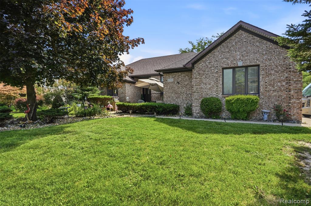 Brick exterior with dark trim and a gabled roofline
