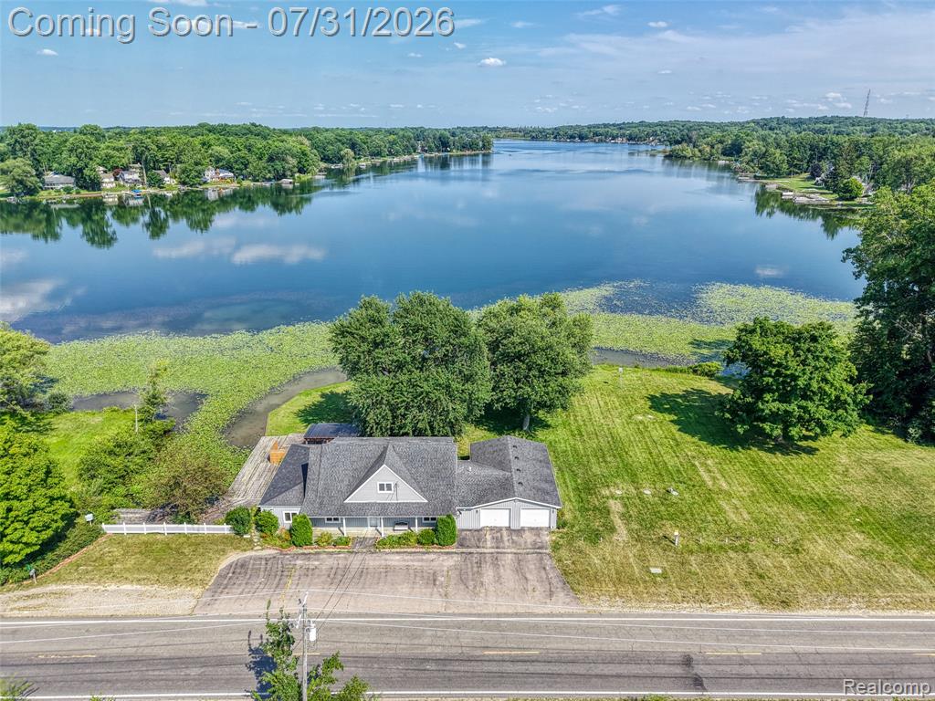 Lakefront living with room to breathe! Welcome to 5249 Reno Rd, a rare opportunity to enjoy a spacious waterfront setting with beautiful views, generous outdoor living space, and exceptional versatility. The property opens to a broad, level backyard leading toward the water, creating an ideal setting for summer gatherings, yard games, relaxing by the lake, or simply enjoying the peaceful view.A large covered deck takes full advantage of the setting and offers a fantastic spot for morning coffee, evening dinners, or entertaining while overlooking the water. Mature trees provide shade and character, while the open lawn gives you plenty of usable space between the home and shoreline.One of the standout features is the oversized garage/workshop, offering substantial room for vehicles, lake toys, tools, storage, hobbies, or projects—an increasingly hard-to-find feature in a waterfront property.Inside, this home offers the chance to create your own retreat while enjoying the lifestyle that makes lake living so desirable. Whether you're looking for a year-round residence, weekend getaway, or a place where friends and family can gather, this property offers a unique combination of waterfront, outdoor space, storage, and potential.Bring the boat, fishing gear, kayaks, and your plans for summer. Opportunities with this much usable lakefront space and flexibility don’t come along often—come see what life on Reno Road could look like.Sale subject to beneficiary approval.