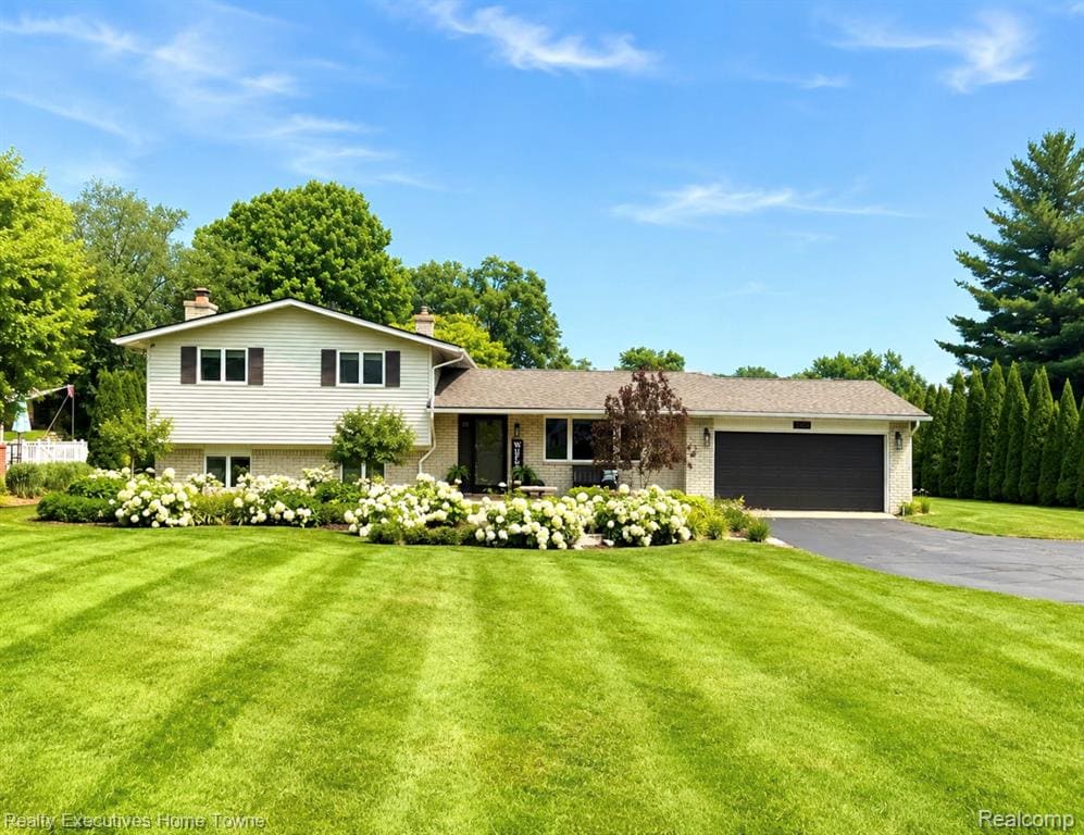 Don’t miss out on this beautifully maintained 4-bedroom home located on the highly desirable PRIVATE All-Sports Duck Lake. ONLY your friends and neighbors are enjoying the 250 acres and NOT hundreds of people you do not know, offering stunning water views, exceptional outdoor living, and numerous recent updates.  This home is perfect for year-round living.  Entertain family and friends both inside and out.  Enjoy the fireworks and other weekly events on the lake.  Enough parking for a dozen cars.  The home is on a huge lot, so don't forget to bring all the lawn games.The spacious floor plan features a large primary bedroom overlooking the lake.  This room can be used as a family room as well.  Watch the sunrise from the comfort of your bed.  New carpet and new vinyl flooring throughout the entire home, and a bright welcoming living space. The home includes all new appliances including a stackable washer and dryer, refrigerator, induction range, slimline microwave, and dishwasher—making it truly move-in ready.  You will never be without power as a 24kw generator was installed 8 months ago.  The home also has a newer hot water tank, furnace, and 200 amp service just in case you want a hot tub!. Step outside to your backyard oasis featuring a brand-new 18’ x 16’ gazebo on the 24x20 trex deck, a newly constructed beach, complete with bonfire pit, fresh professional landscaping, a massive raised organic garden, and direct access to beautiful Duck Lake. Whether you’re boating, kayaking, fishing for a walleye or largemouth bass, or simply enjoying sunsets on the water, this property offers the lake lifestyle you’ve been dreaming of.  The lakefront comes to life in the winter as well.  A full size ice rink has been maintained out on the ice for years.  Don't forget snowmobiling, cross-country skiing, and ice fishing to name a few.Minutes to Highland Rd/M59 with shopping and great restaurants.  An Elementary School in the neighborhood and just minutes from Downtown Milford.Please make your offer today!  SEE, DREAM