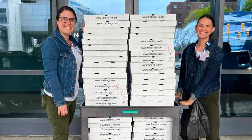 employees with pizza boxes (1)