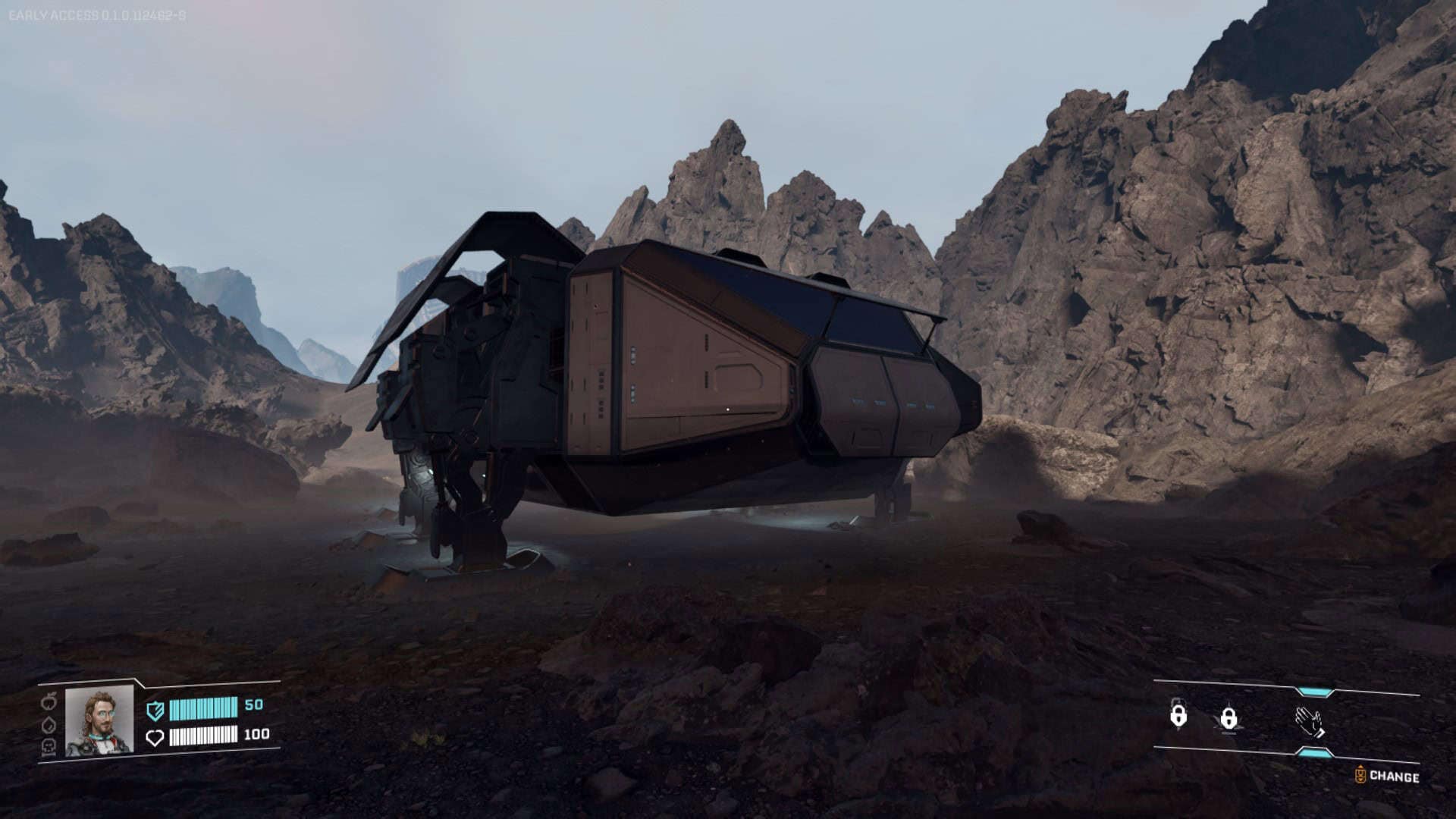 A spacecraft sitting in a small rocky canyon