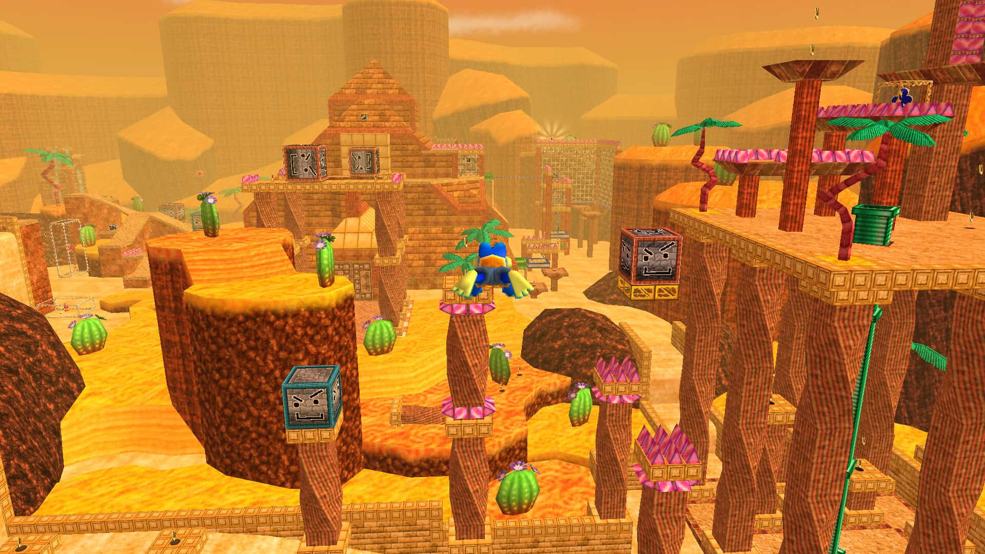 The protagonist, a blue frog, falling towards a large sandy level