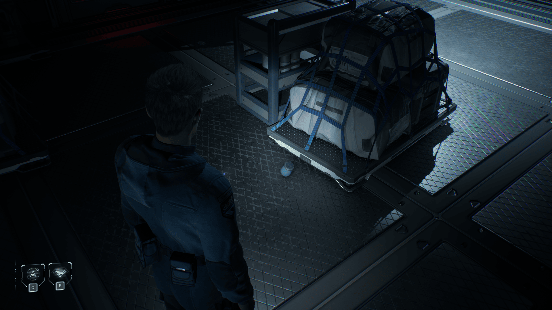 A man in a sci-fi outfit on a spaceship observes an out of place spinning mug - screenshot from Directive 8020