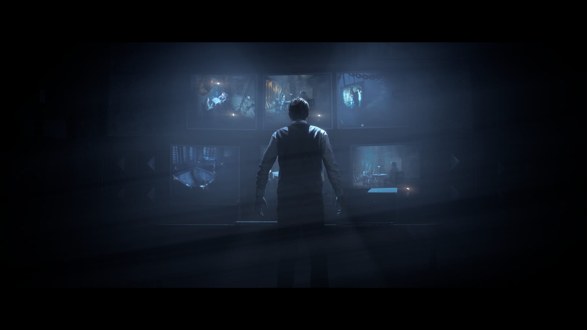A screenshot of a man staring at TV screens in Until Dawn