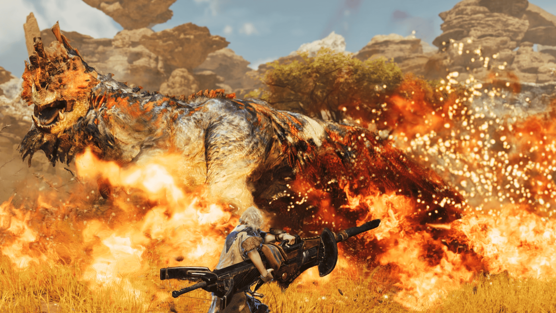 Screenshot from Monster Hunter Wilds of a female hunter with a heavy bowgun fighting a Quematrice - a chicken-like monster - as fire surrounds them.