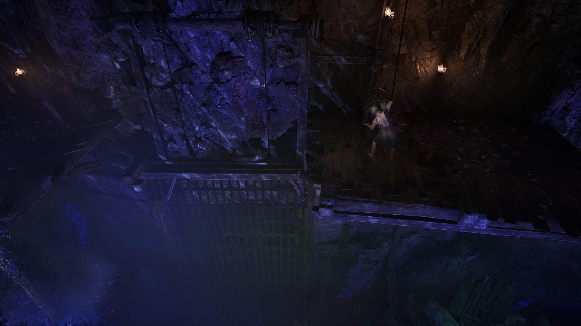 The protagonist cranking open a a gate