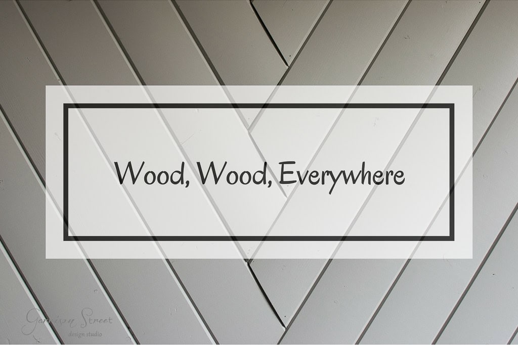 A diagonal wood pattern background with a white rectangular overlay containing the text "Wood, Wood, Everywhere" in the center.