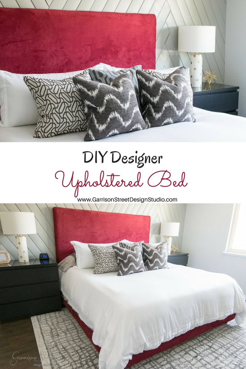 A stylish bedroom with a red upholstered bed, white bedding, and patterned decorative pillows. The room features a chevron accent wall, dark nightstands, and modern decor. Text reads "DIY Designer Upholstered Bed" with a website link below.