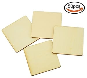 Four wooden square pieces are arranged with their edges overlapping. A "50pcs" label with a stylized arrow is in the top right corner.