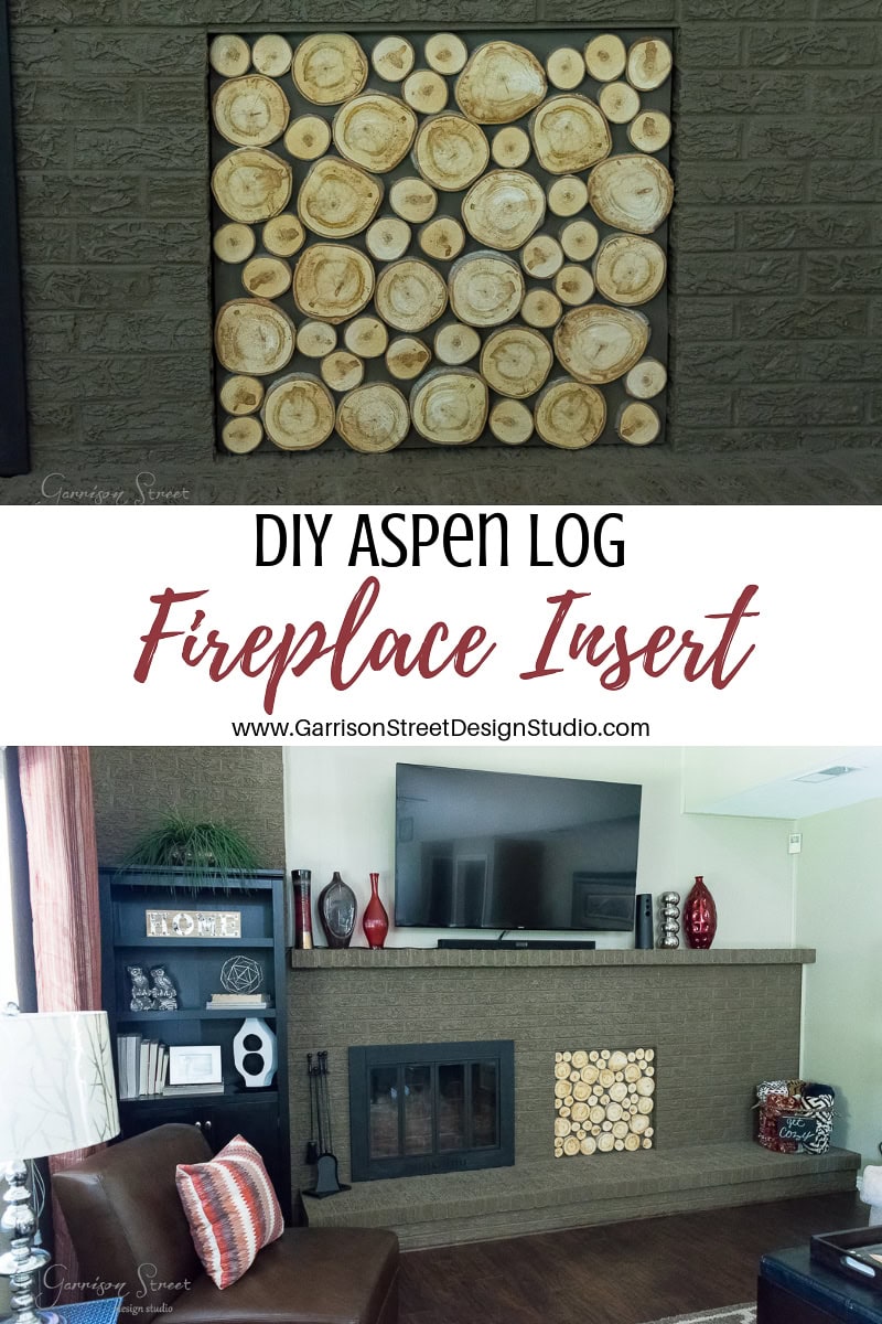 A room with a brick fireplace features a DIY fireplace insert made of circular slices of aspen logs arranged in a grid pattern. The mantel is adorned with vases, and a TV is mounted above, creating a cozy and stylish focal point.