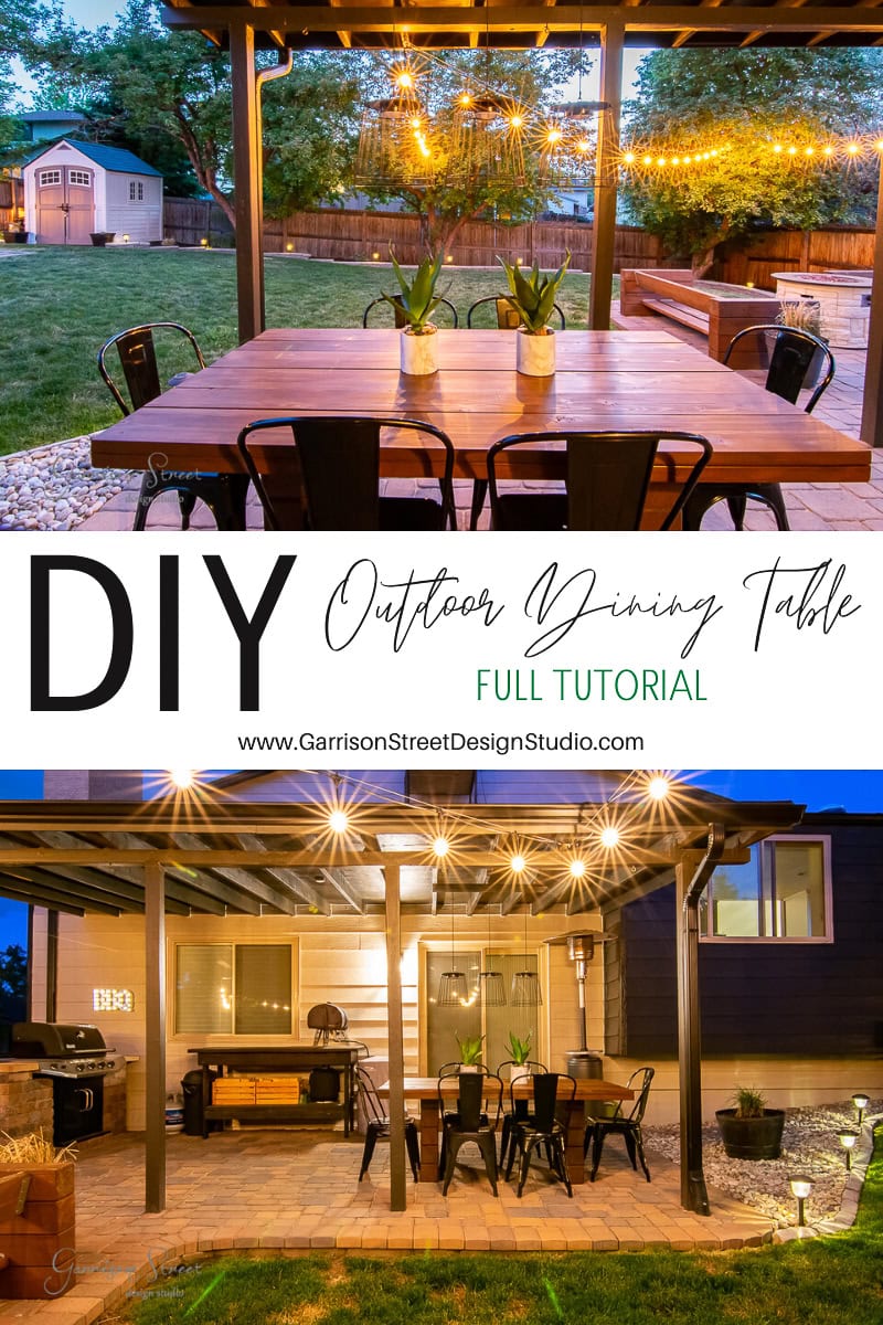 A DIY outdoor dining table, beautifully crafted from wood, is set under a pergola adorned with string lights. This enchanting scene in a backyard with trees and a shed invites you to explore the tutorial and create your own oasis.