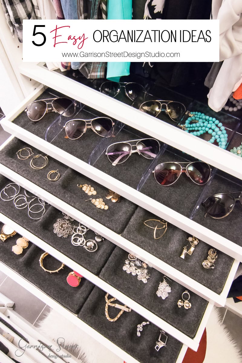 An open drawer showcases neatly organized sunglasses and jewelry, including bracelets and earrings, in gray felt-lined compartments. Above, a banner reads "5 Easy Organization Ideas." In the background, clothes add a touch of everyday elegance to these creative organization ideas.