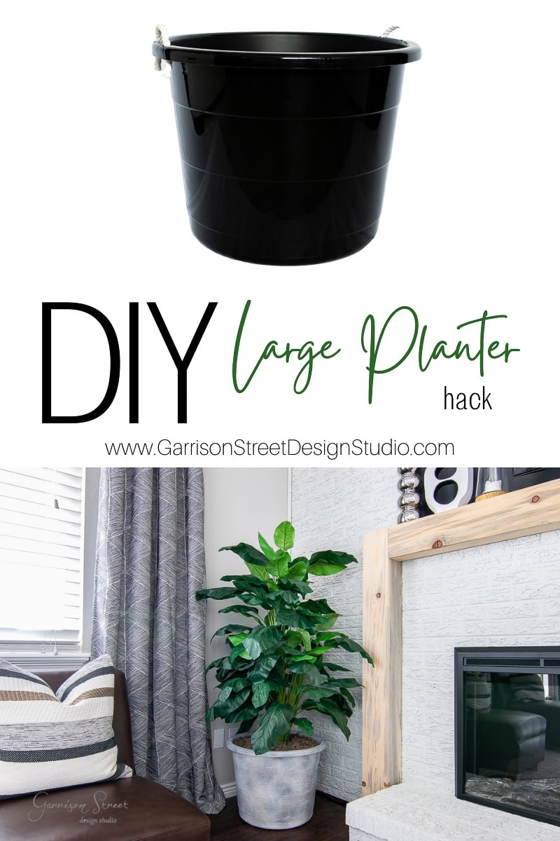 A black plastic bucket and a large indoor plant sit beside a modern fireplace, showcasing the perfect DIY large planter hack. Text overlay reads, "DIY Large Planter Hack" with a website URL.