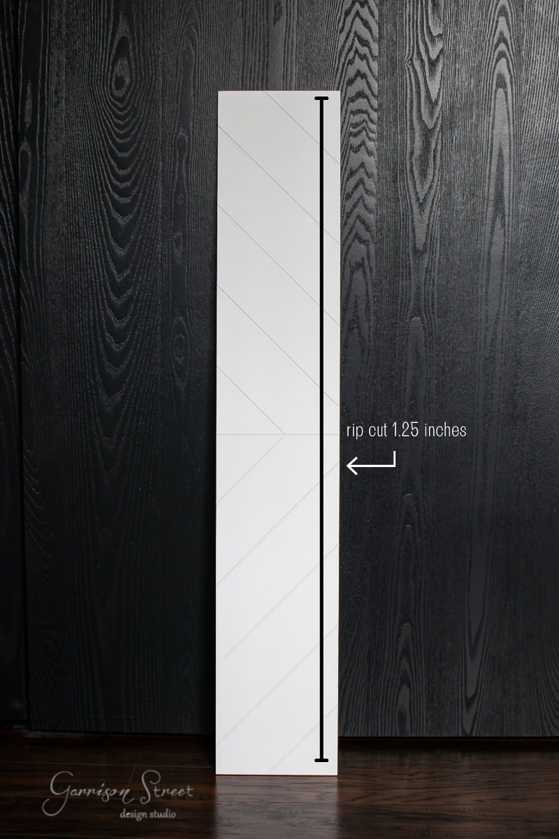 A long, narrow white panel is shown against a dark, textured background. The panel features a diagram with a vertical arrow and the text "rip cut 1.25 inches" pointing to the left edge, ideal for cutting risers or stair treads with precision.